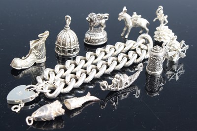 Lot 312 - A heavy silver curblink bracelet having heart...