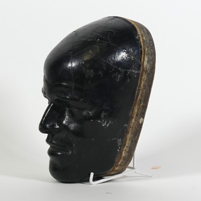 Lot 81 - A black painted composite death mask, h.24cm