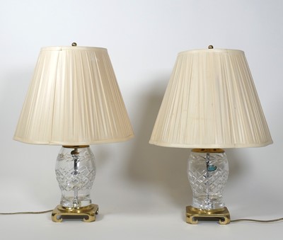 Lot 73 - A pair of cut glass table lamps, each having a...