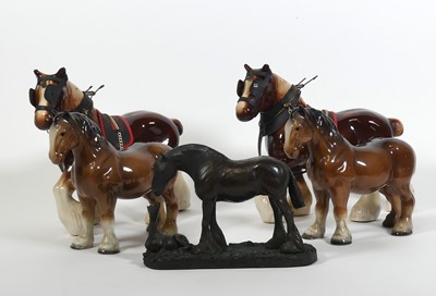 Lot 4 - A group of horse figures, to include a pair of...