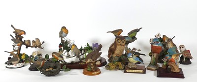 Lot 28 - A collection of figures of birds, to include...
