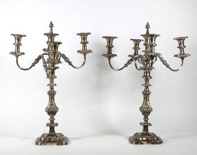 Lot 110 - A pair of silver plated four-branch table...
