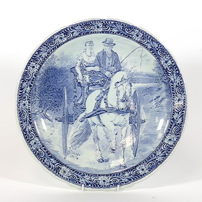 Lot 102 - A Delft blue & white charger, late 20th...