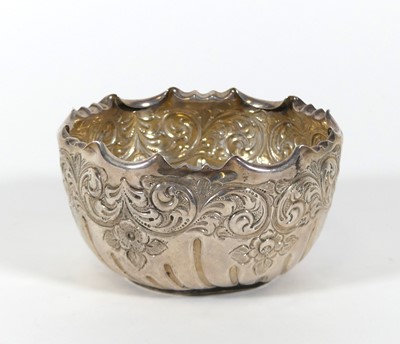 Lot 202 - An Edwardian silver sugar bowl having a shaped...
