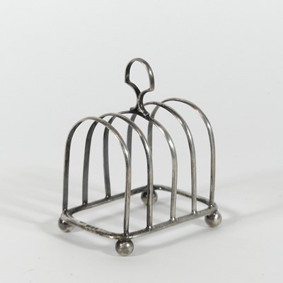 Lot 204 - A George VI silver four division toast rack,...