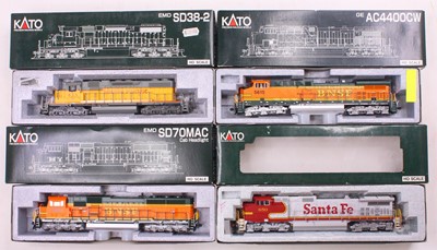 Lot 479 - Four Kato HO gauge locos to include an SD-70,...