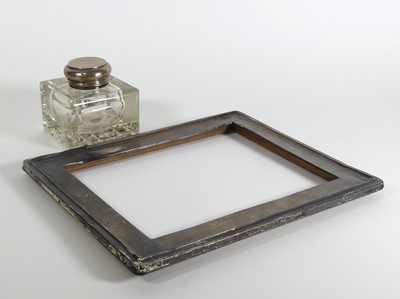 Lot 181 - A silver clad photograph frame (a/f), together...