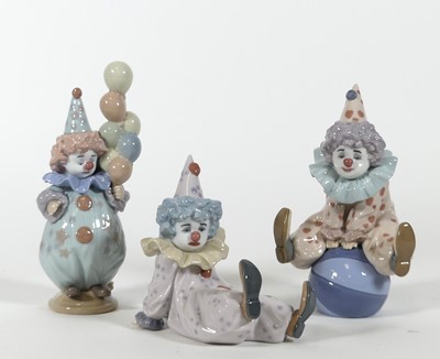 Lot 184 - A group of three Lladro figures of clowns, to...