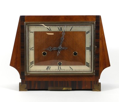 Lot 7 - An Art Deco walnut cased mantel clock, having...