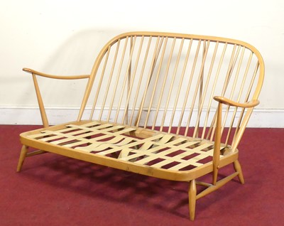 Lot 423 - An Ercol blond beech three-piece stickback...