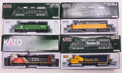 Lot 488 - Four HO gauge Kato locos to include an SD-45,...