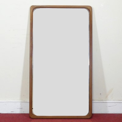 Lot 428 - A 1960s Danish teak wall mirror by Jansen...