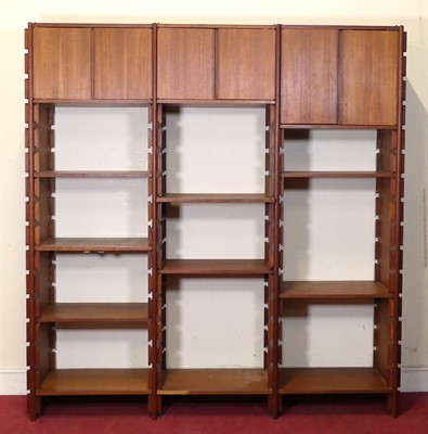 Lot 438 - A 1970s teak systematic three-bay wall unit,...