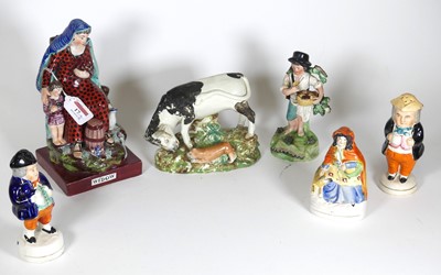 Lot 17 - A group of Staffordshire figures, to include a...
