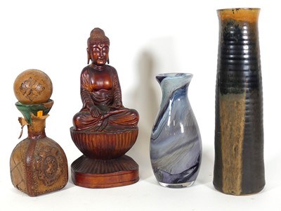 Lot 54 - A carved wooden figure of Buddha, model seated...