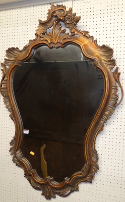 Lot 1105 - A 19th century Rococo style floral carved and...