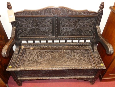 Lot 1112 - An early 20th century line carved oak hinge...