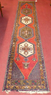 Lot 1124 - A Kurdish woollen blue, red and cream ground...
