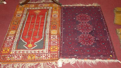 Lot 1127 - A Persian woollen red and blue ground Bokhara...