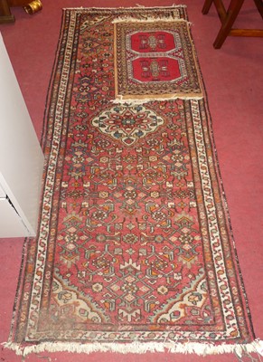 Lot 1128 - A Turkish woollen red ground hall runner, 205...