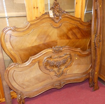 Lot 1157 - A circa 1900 provincial French carved walnut...