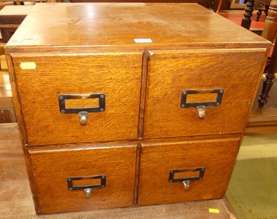 Lot 1174 - An early 20th century oak table top set of...