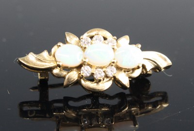 Lot 325 - A yellow metal flower head brooch, set with...