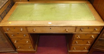 Lot 1177 - A Victorian oak and gilt tooled green leather...