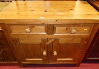 Lot 1184 - A pine double door side cupboard, with twin...