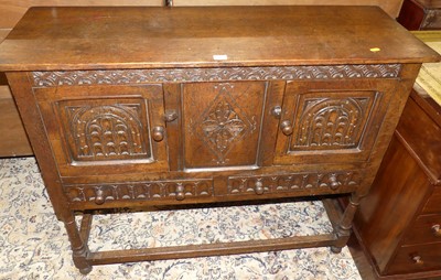 Lot 1192 - A small joined oak double door side cupboard,...