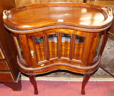 Lot 1195 - A contemporary hardwood kidney shaped single...