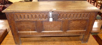 Lot 1199 - An antique joined oak three panelled hinge...