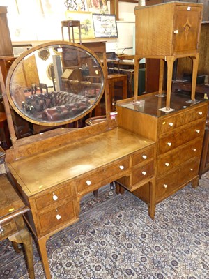 Lot 1215 - An Art Deco figured walnut and crossbanded...