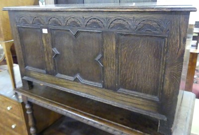 Lot 1216 - An oak geometric moulded three-panel hinge...