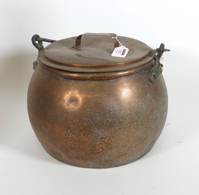 Lot 111 - A 19th century copper cauldron, having an iron...