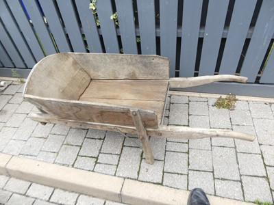 Lot 1285 - A wood and metal bound twin handled barrow,...