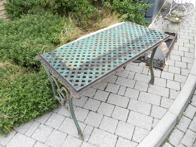 Lot 1289 - A cast iron garden side table, having a...