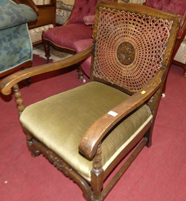 Lot 1260 - A 1930s beech framed open armchair, having...