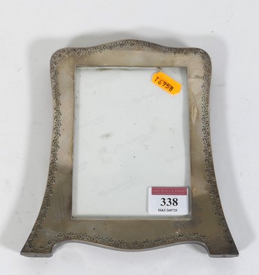 Lot 338 - A George V silver clad easel photograph frame,...