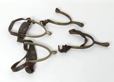 Lot 374 - Two pairs of metal spurs