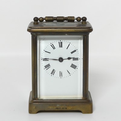 Lot 385 - A lacquered brass carriage clock, having a...