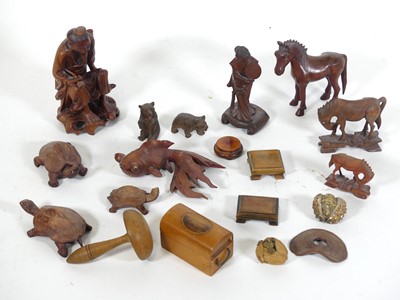 Lot 399 - A collection of carved wooden figures, to...