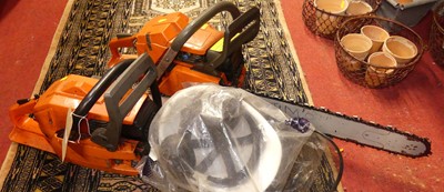 Lot 1077 - A petrol driven chainsaw, with one other...