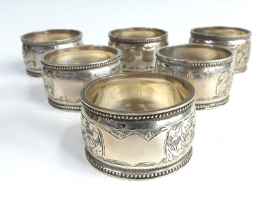 Lot 2105 - A cased set of six Edwardian silver napkin...