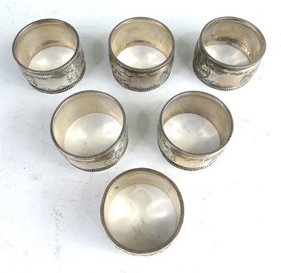Lot 2105 - A cased set of six Edwardian silver napkin...