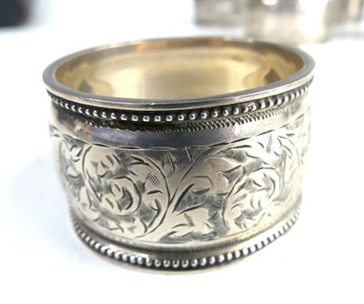 Lot 2105 - A cased set of six Edwardian silver napkin...