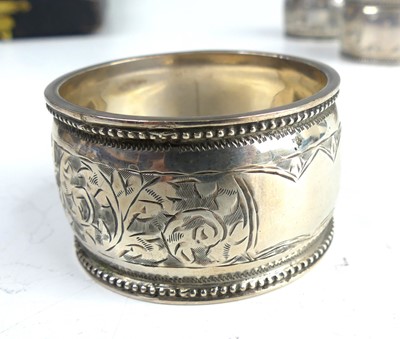 Lot 2105 - A cased set of six Edwardian silver napkin...