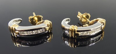 Lot 2629 - A pair of white and yellow metal diamond...