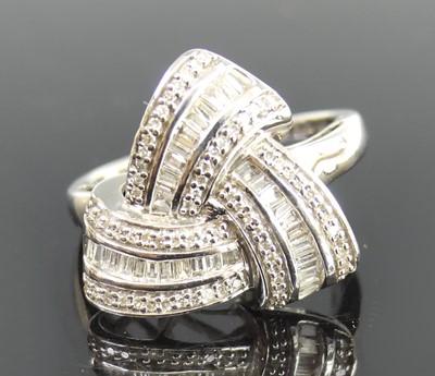 Lot 2687 - A 9ct white gold diamond multi-strand ring,...