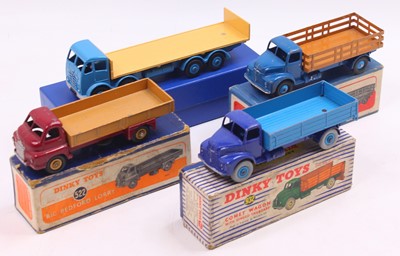 Lot 1410 - A Dinky Toys group of four mostly playworn...